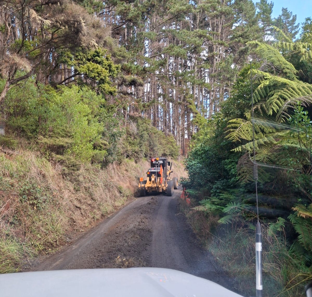 Grader ahead on unsealed road