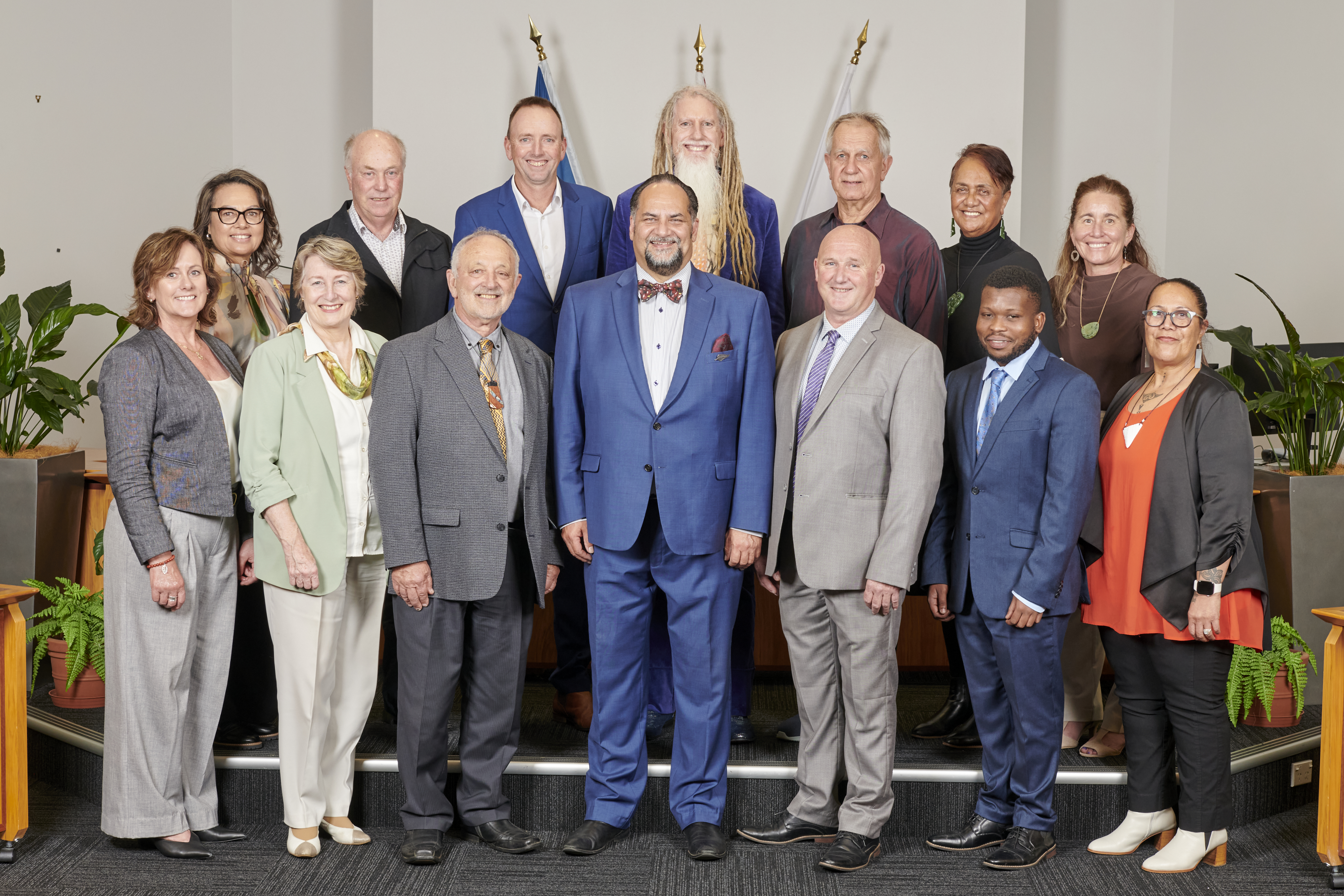 Mayor and councillors stand together in the council chambers