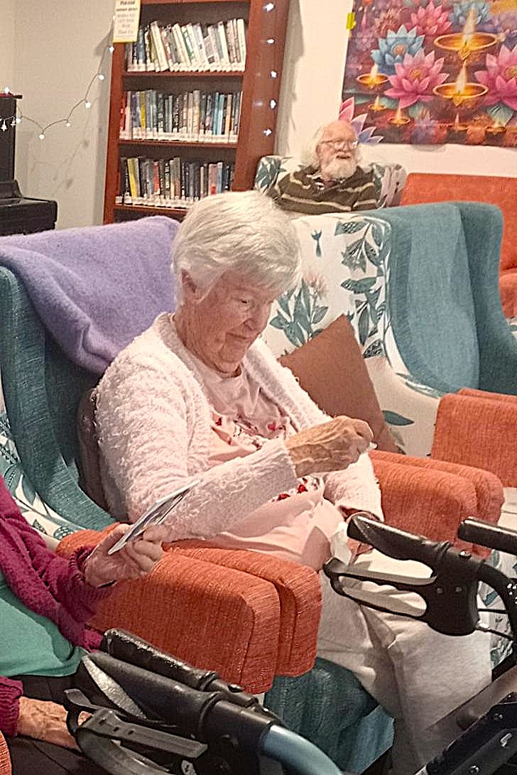 Rest home resident looks at the drawing