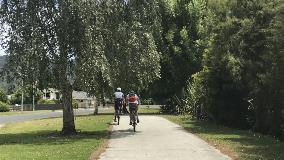 Cyclists on Waikato Esplanade 16x9 crop Cyclists on Waikato Esplanade, Ngaruawahia