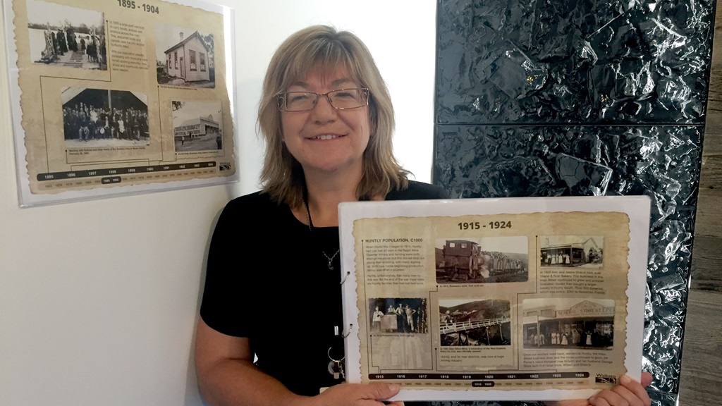 Maria-Cleland Library coordinator Maria Cleland pictured with the heritage posters at Huntly Library and Council Office.