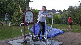Waikato District Mayor Allan Sanson tries the new fitness trail cycle strider