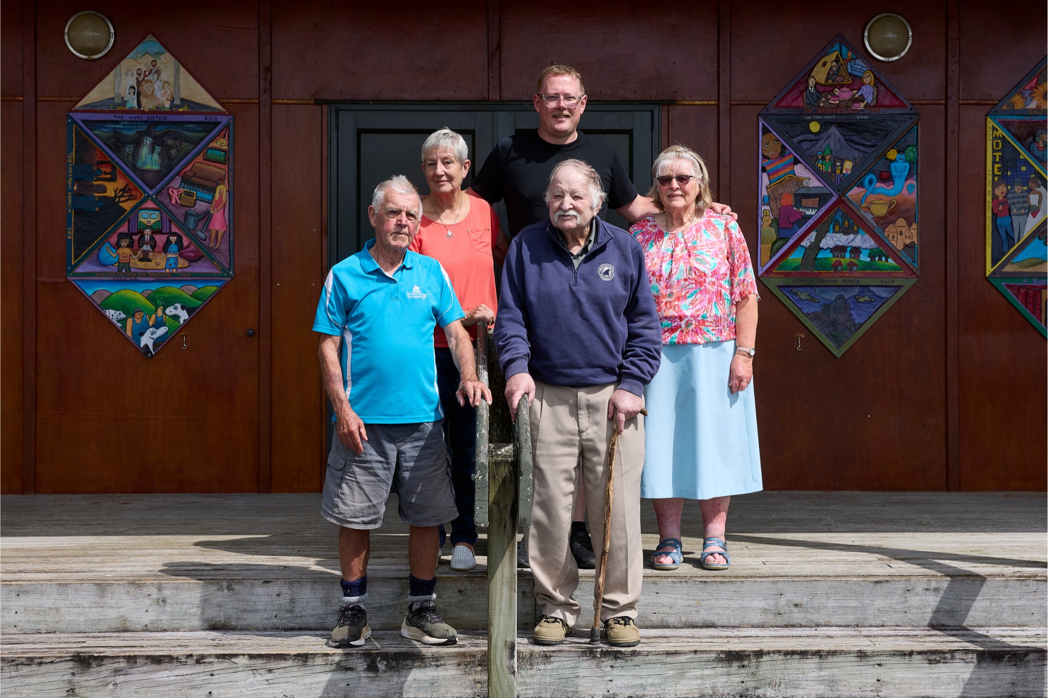 Five members of the Onewhero Society of Performing Arts standing in front of the theatre