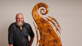 Wayne Ross with his sculpture, Inanga,  which is on display in the Waikato District Council’s foyer during Matariki.  